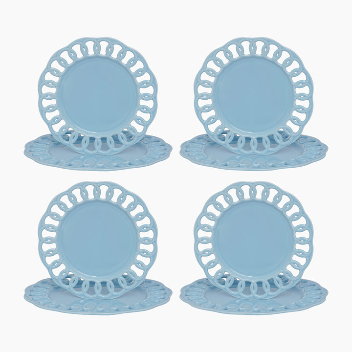 Baby blue ceramic dinner and salad plates stacked to show layered lace borders