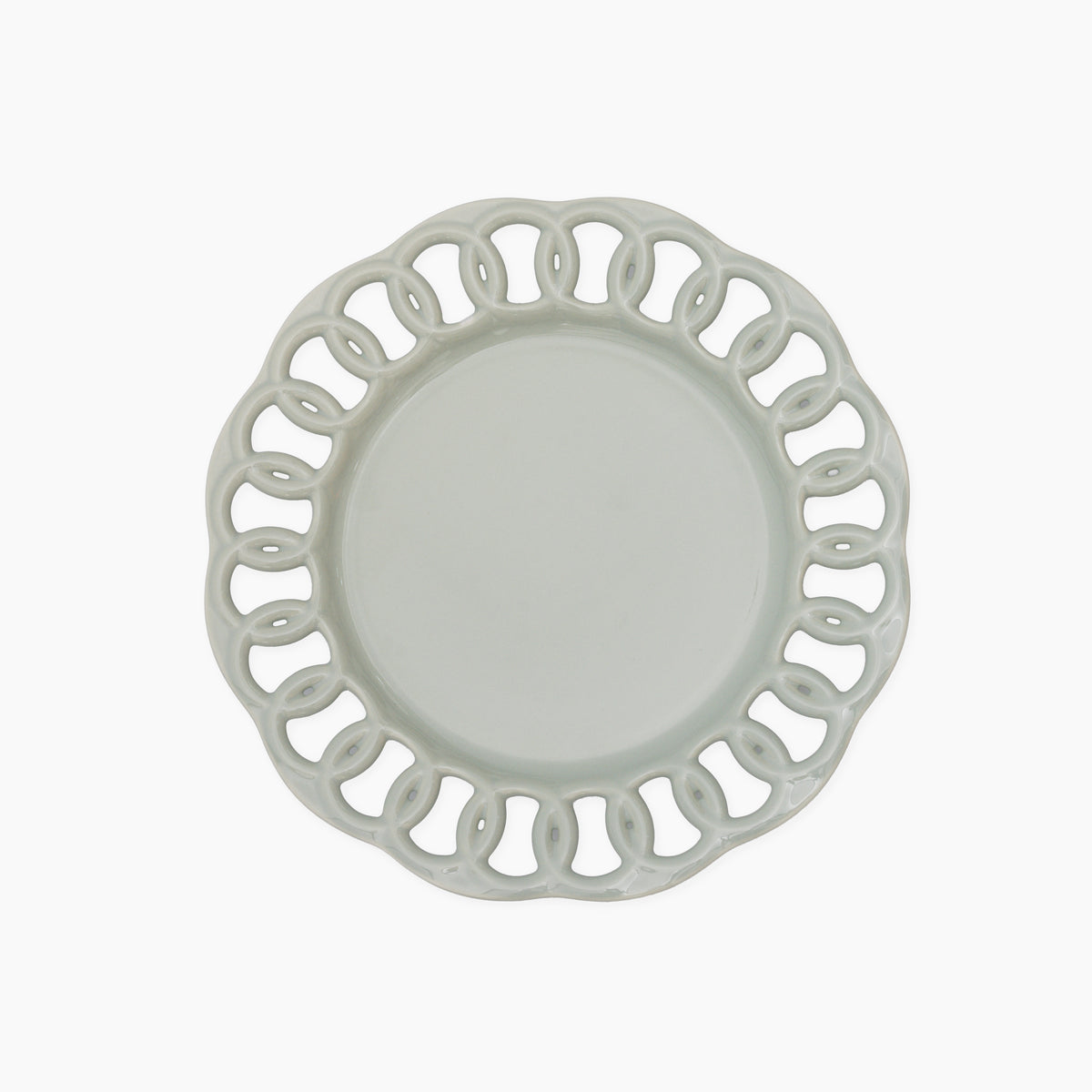 Sage green ceramic salad plate with an intricate openwork lace border