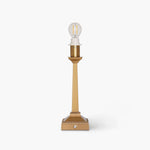Handcrafted rattan cordless lamp in gold adds a modern touch and elegant ambiance to artisan home decor.