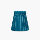 Handcrafted rattan cordless lamp in teal velvet with pleated design and bow detail.