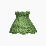 Handcrafted rattan cordless lamp shade made from green woven material, enhancing home decor with style.