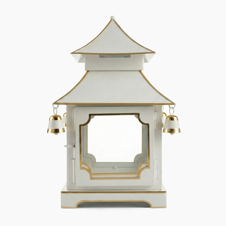 Ivory chinoiserie pagoda candle lantern in iron and glass with hand-painted gold accents and small hanging bells