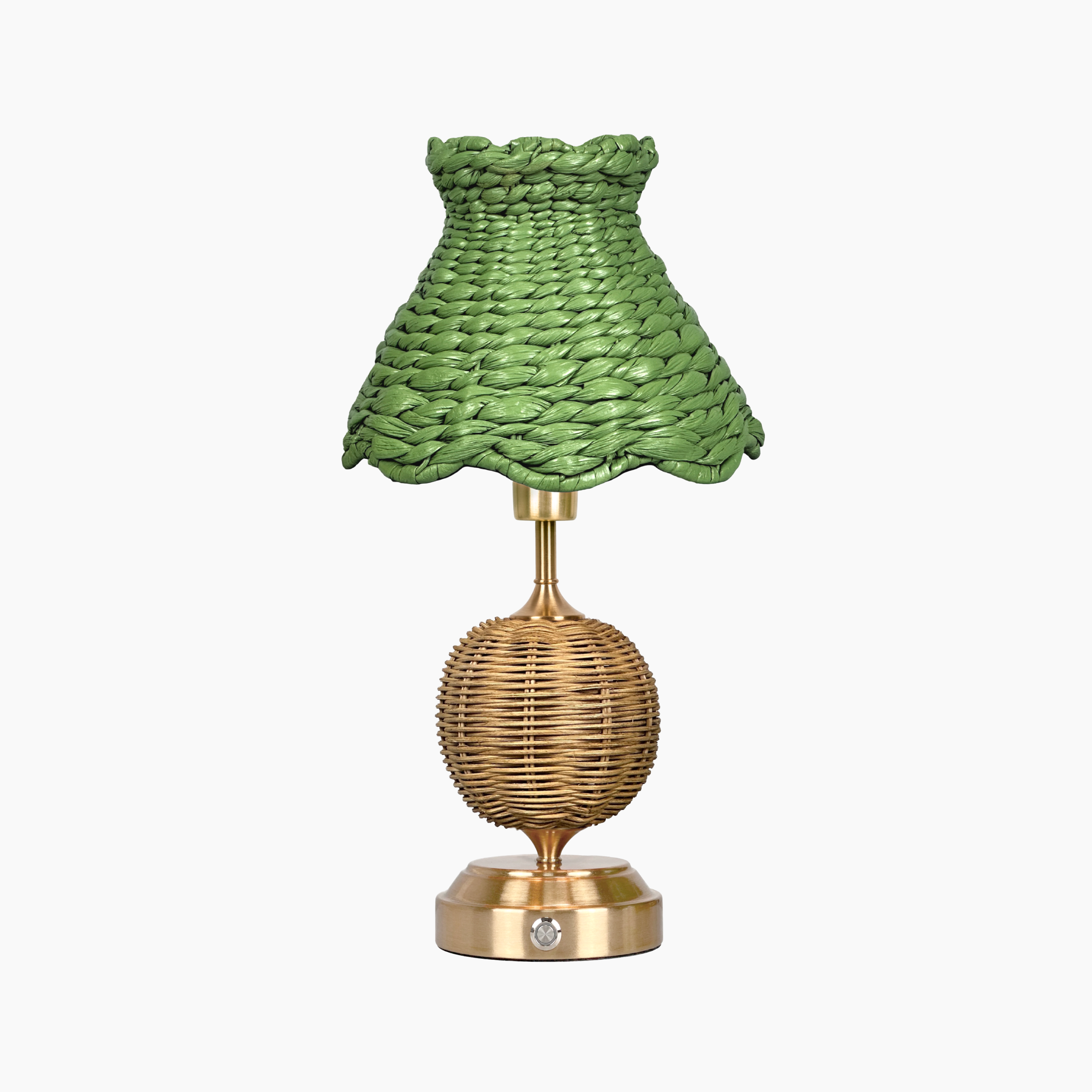 Table lamp with green woven shade and gold base on a white background