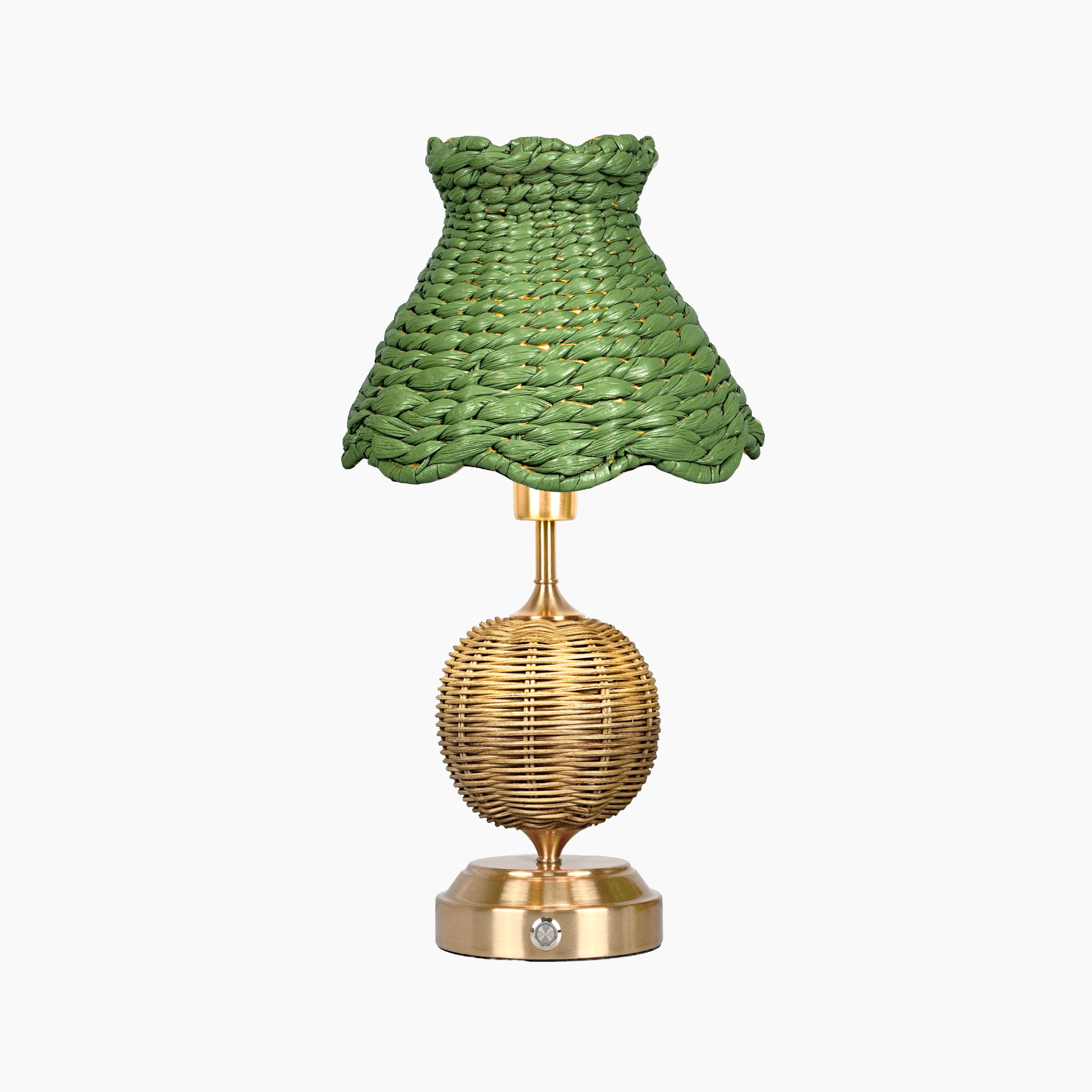 Table lamp with green woven shade and gold base on a white background