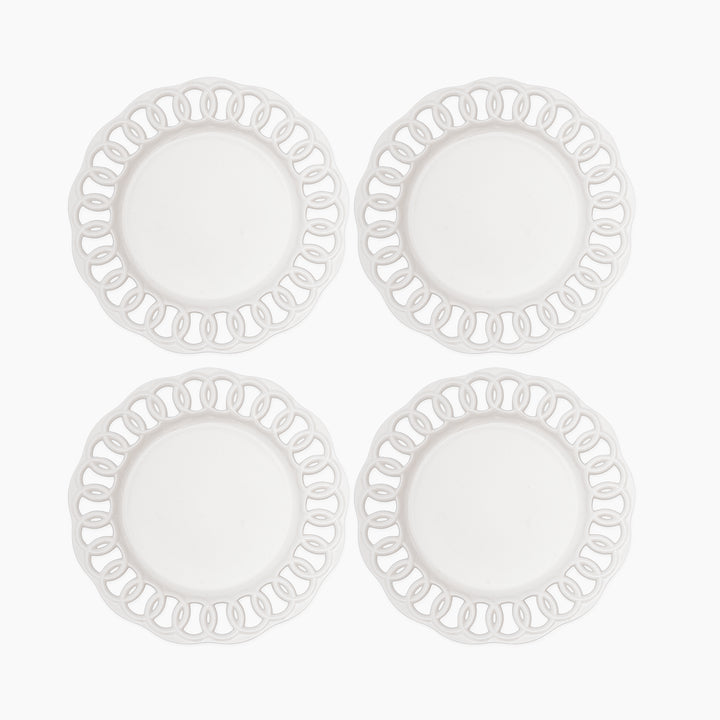 Set of four white ceramic dinner plates with openwork lace rims