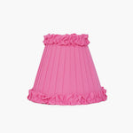 Handcrafted rattan cordless lamp with a bright pink pleated lampshade, adding a pop of color to any decor.
