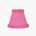 Handcrafted rattan cordless lamp with a bright pink pleated lampshade, adding a pop of color to any decor.