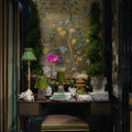 bamboo rechargeable lamp with seagrass shade on a decorative desk with floral wallpaper and decorative items