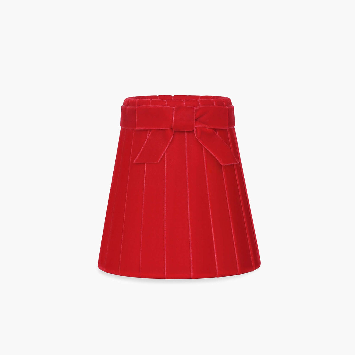Handcrafted rattan cordless lamp shade in vibrant red velvet with pleats and a bow detail.