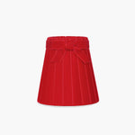 Handcrafted rattan cordless lamp shade in vibrant red velvet with pleats and a bow detail.