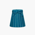 Handcrafted rattan cordless lamp in teal velvet with pleated design and bow detail.